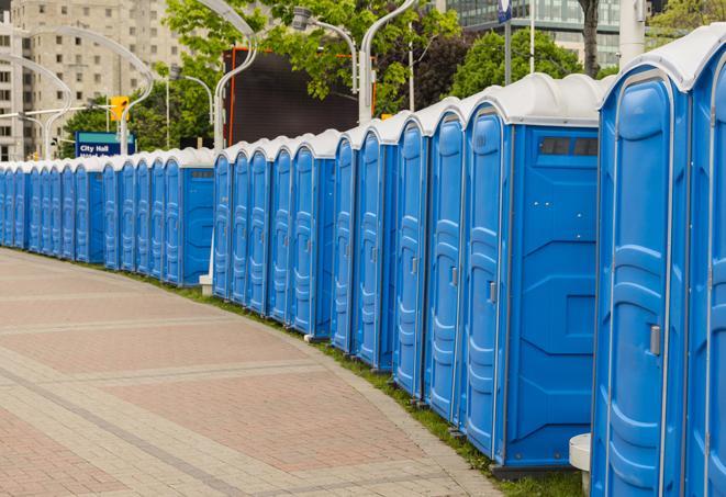 a row of sleek and modern portable restrooms at a special outdoor event in Boxford